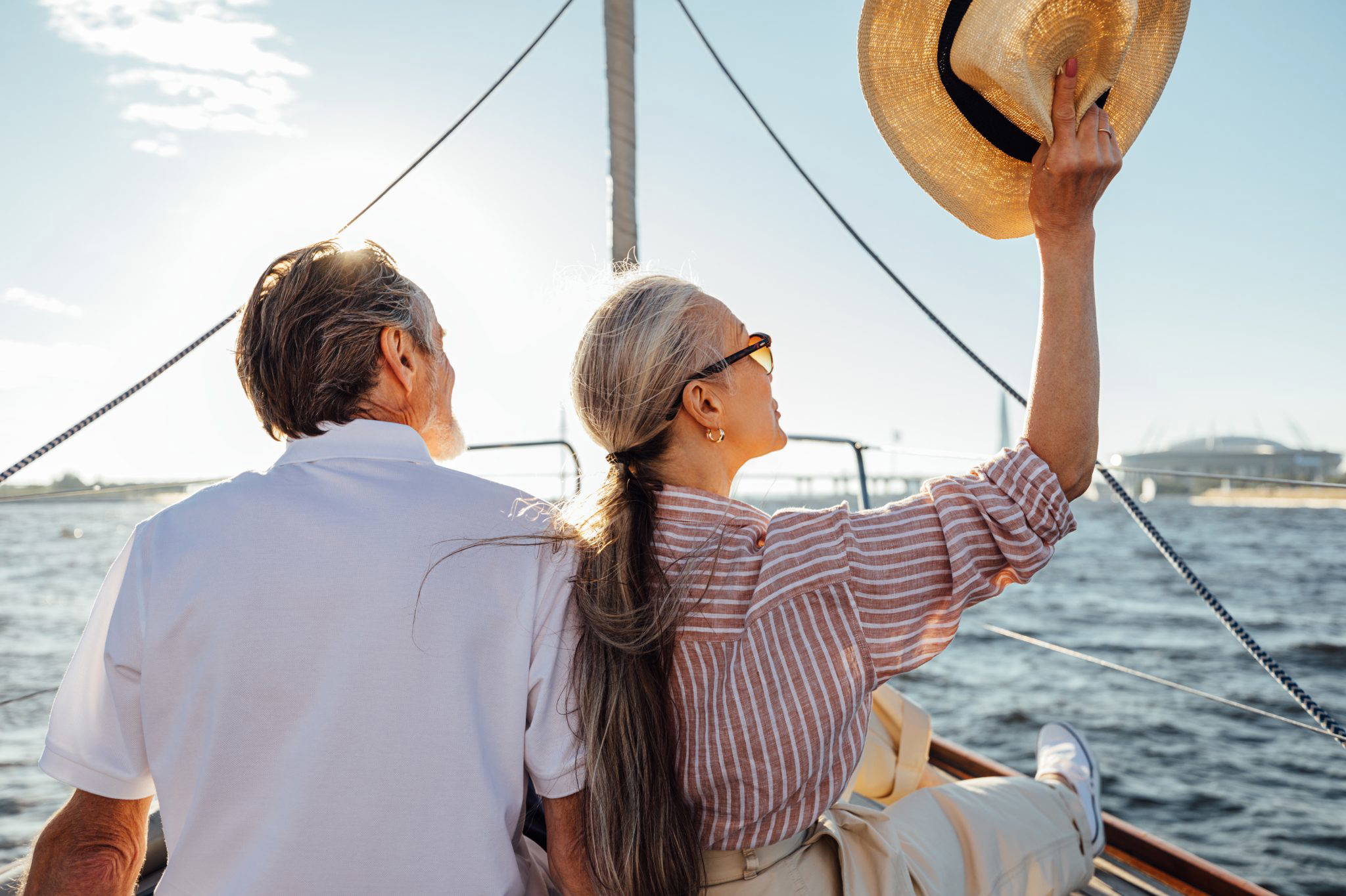 Back,View,Of,Relaxed,Mature,Couple,Sitting,On,Yacht.,Stylish
