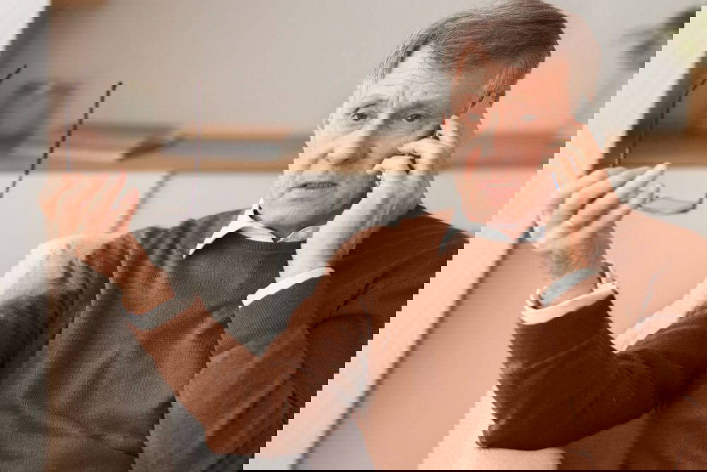 A man talking on a mobile.