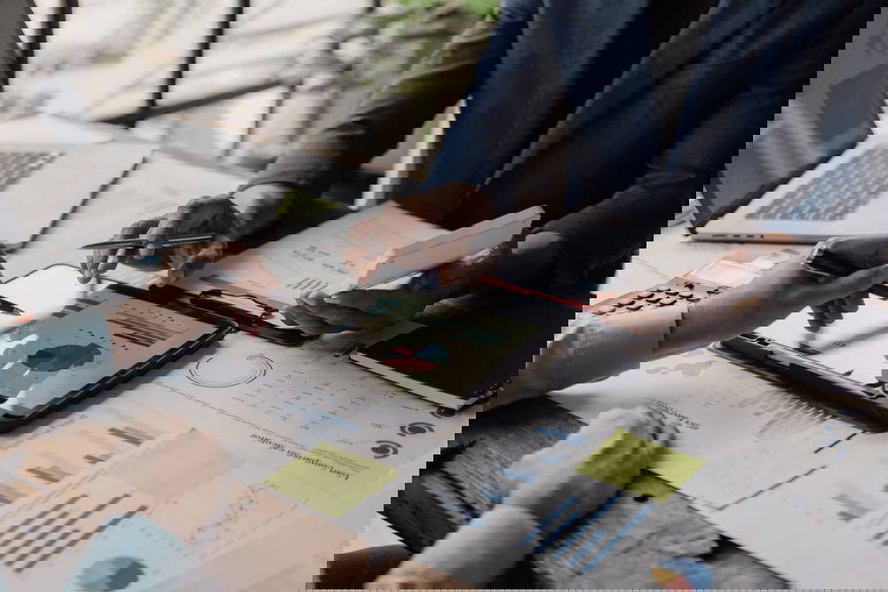 Business people looking at documents in an office.