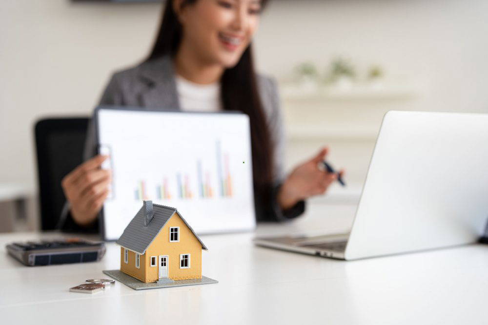 A mortgage adviser showing information to clients.
